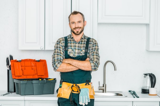 Technician standing in home kitchen